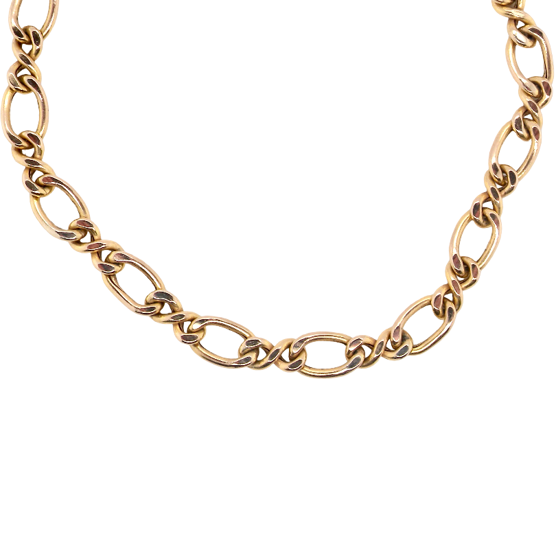 A gold-toned chain necklace with elongated oval links and alternating twisted center details, photographed on a plain white background.