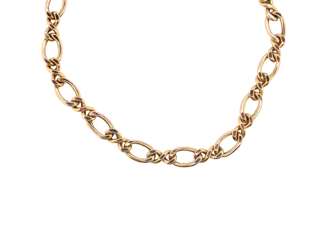 A gold-toned chain necklace with elongated oval links and alternating twisted center details, photographed on a plain white background.