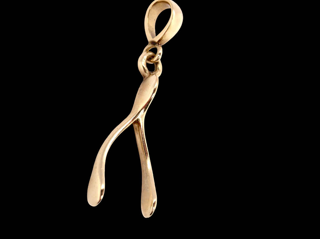 A 9 carat gold pendant (or charm) in the shape of a wishbone.
Overall size 25x10mm,