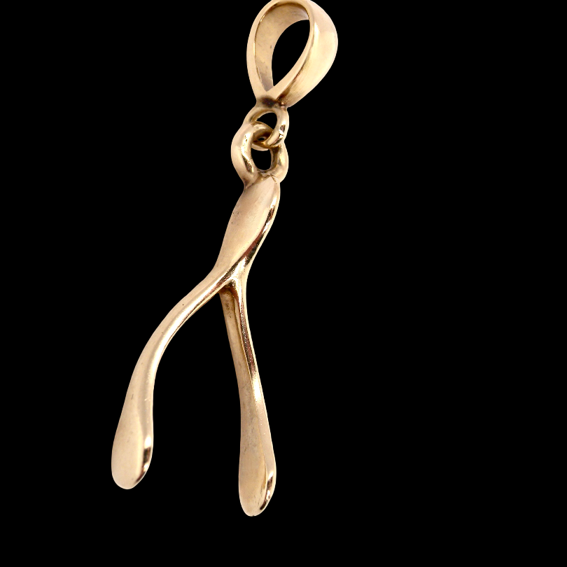 A 9 carat gold pendant (or charm) in the shape of a wishbone.
Overall size 25x10mm,
