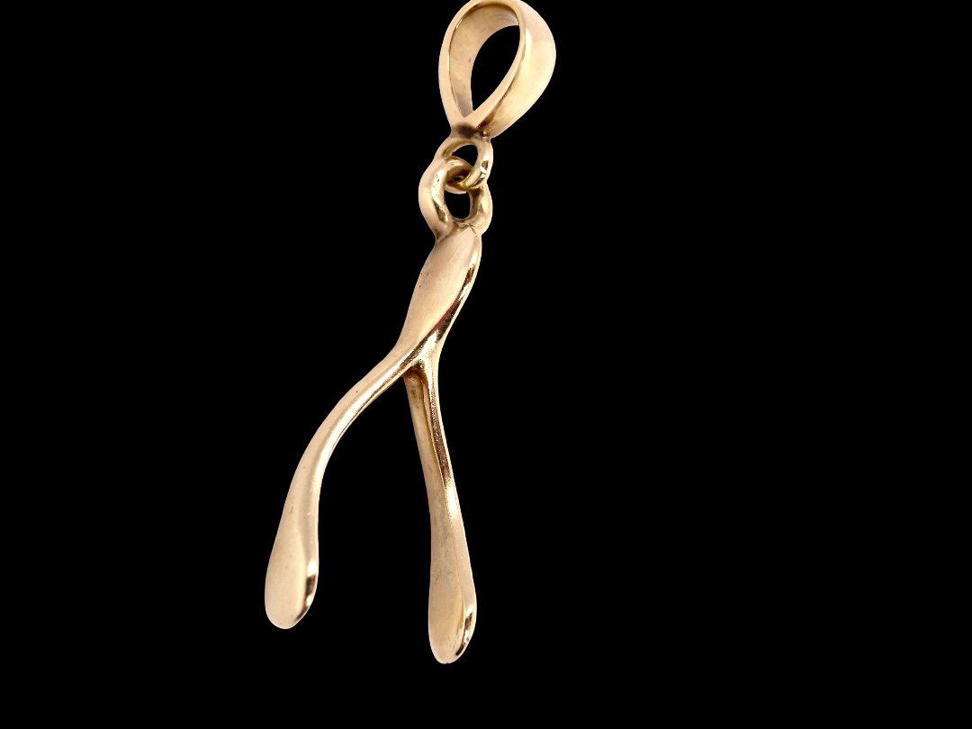 A 9 carat gold pendant (or charm) in the shape of a wishbone.
Overall size 25x10mm,