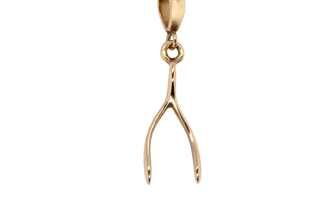 A 9 carat gold pendant (or charm) in the shape of a wishbone.
Overall size 25x10mm, weight 3.1 grams. 
