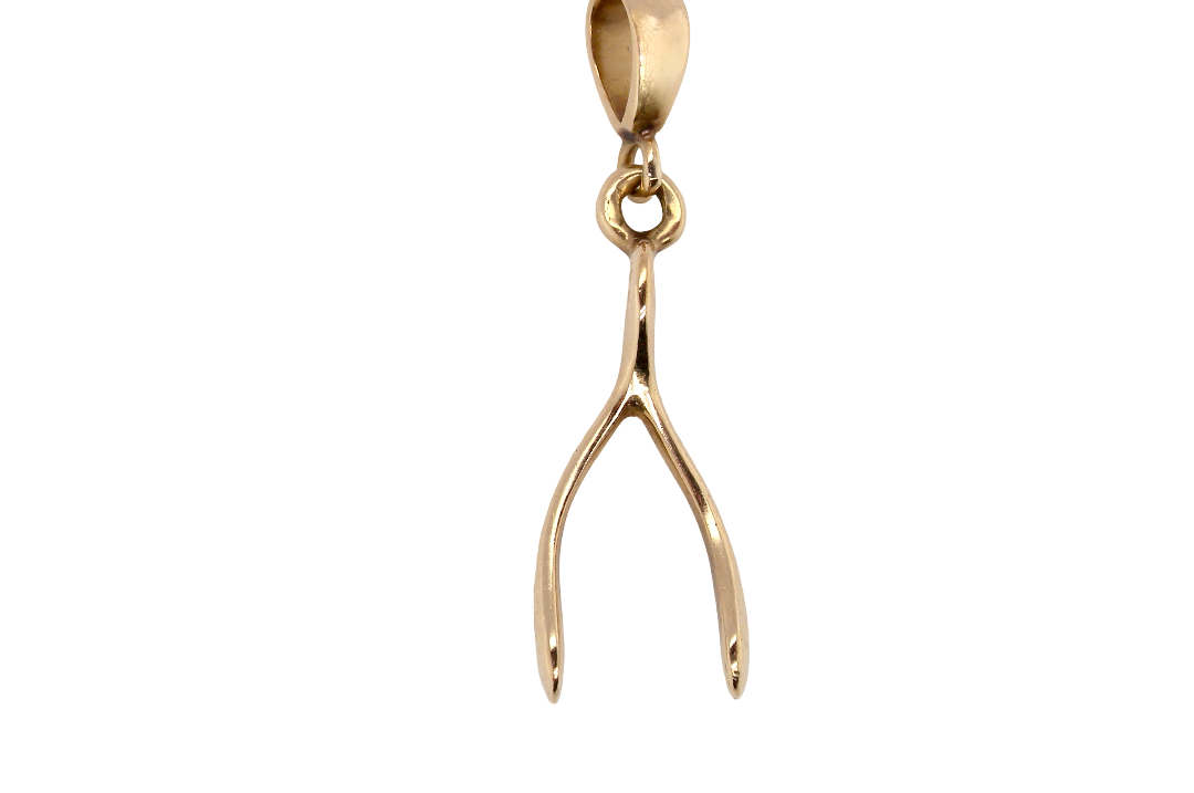 A 9 carat gold pendant (or charm) in the shape of a wishbone.
Overall size 25x10mm, weight 3.1 grams. 