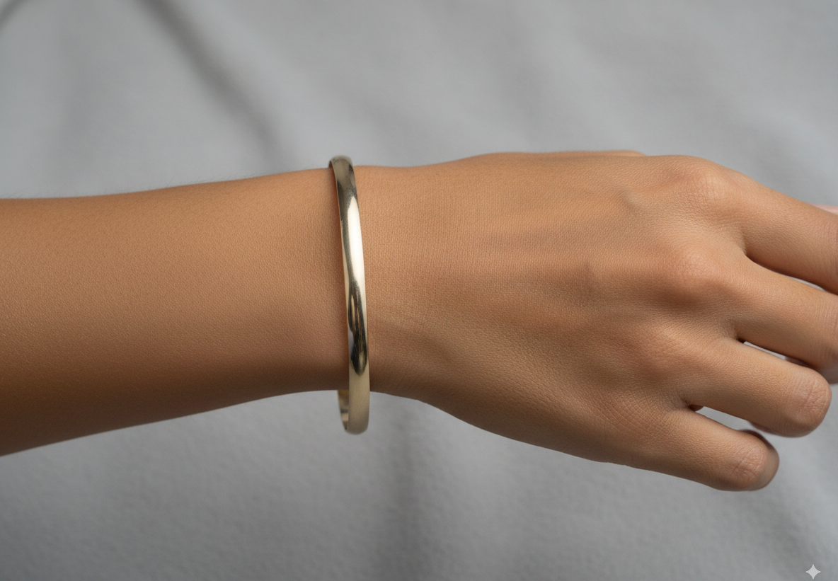 A 9 carat* gold plain bangle