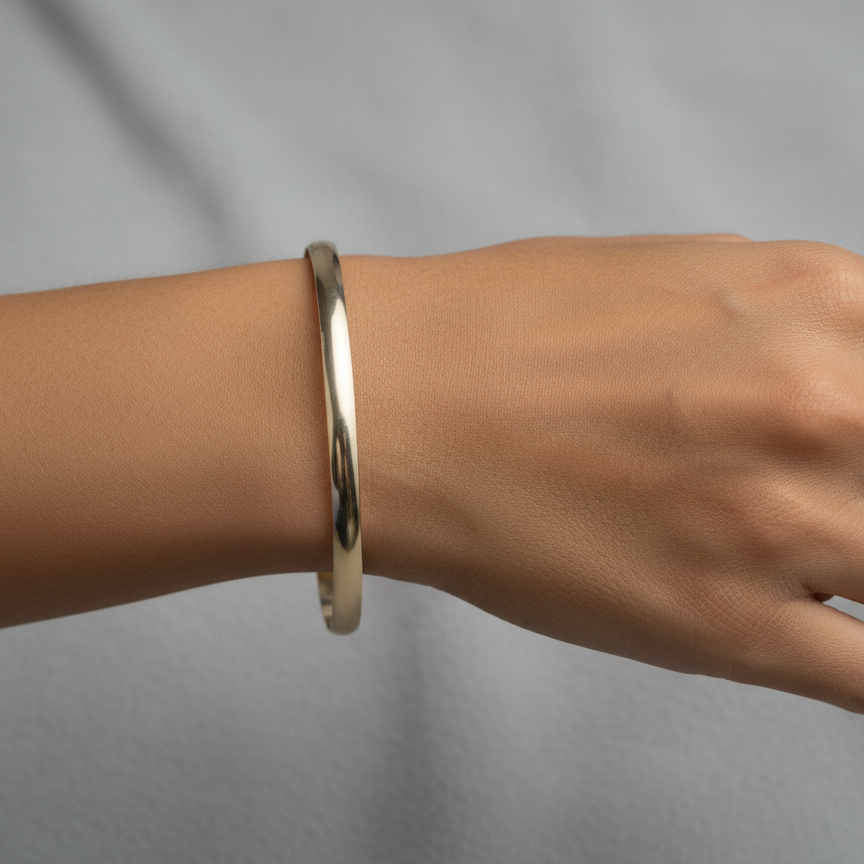 A 9 carat* gold plain bangle