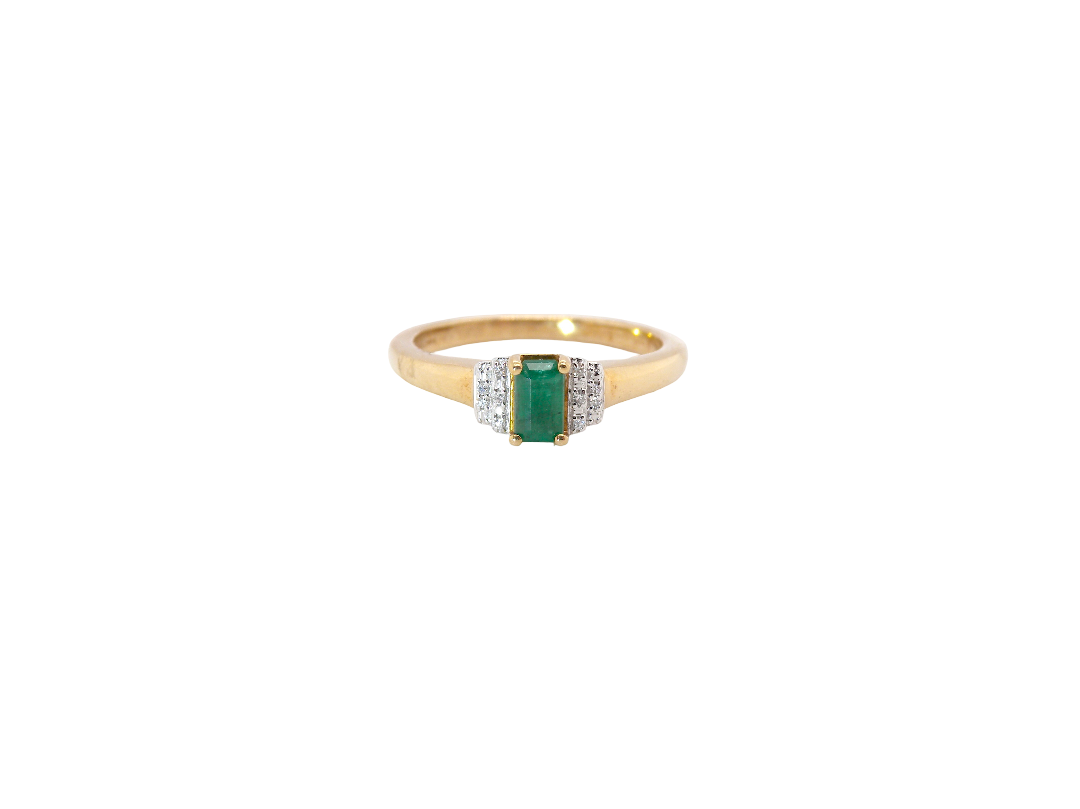 A 9 carat gold ring that features a rectangular cut emerald, 5x3mm (est 0.30 carats)