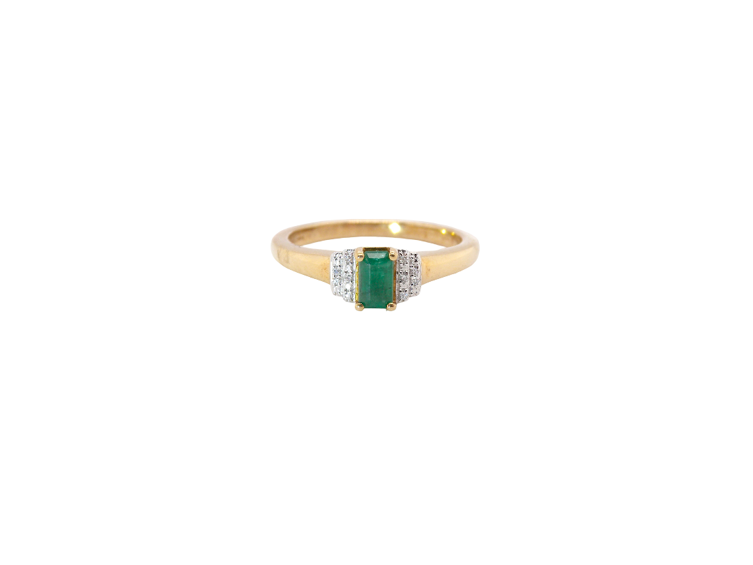 A 9 carat gold ring that features a rectangular cut emerald, 5x3mm (est 0.30 carats)
