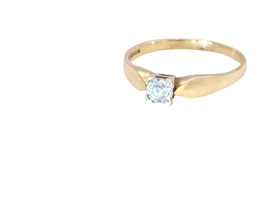 A 9 carat gold solitaire ring. Features a single white diamond 3.4mm (est 0.15 carats)
side