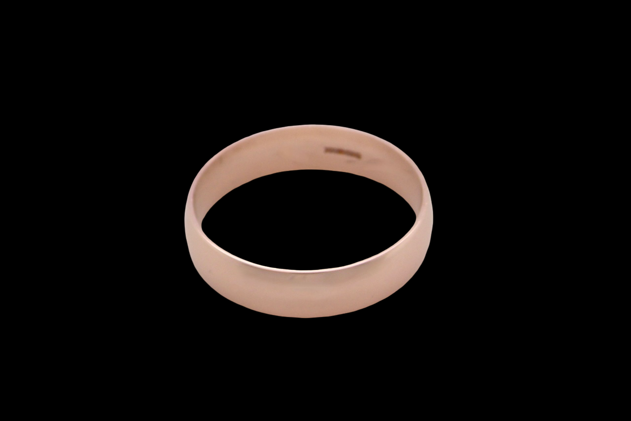 A 9 carat rose gold wedding ring.
Plain D shape
