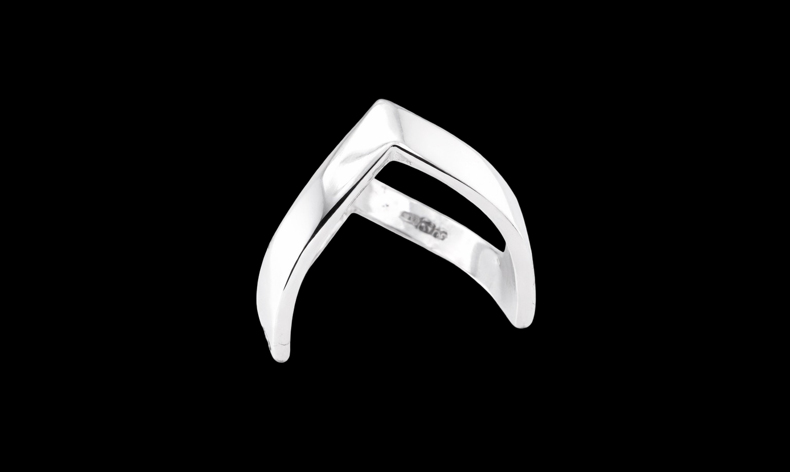 A 9 carat white gold double wishbone ring. with a diamond