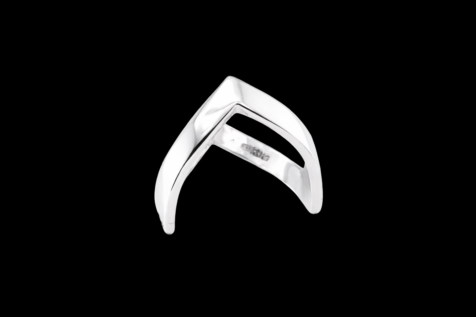 A 9 carat white gold double wishbone ring. with a diamond