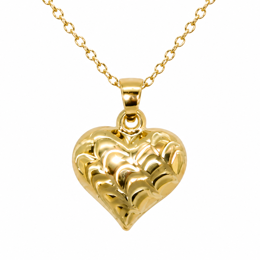 A 9ct gold patterned heart pendant closeup view