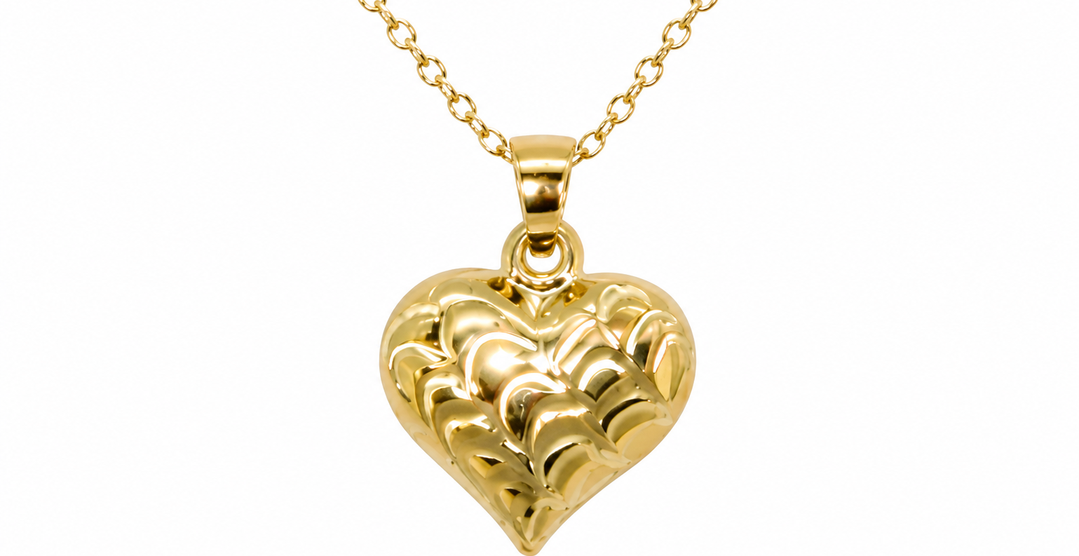 A 9ct gold patterned heart pendant closeup view