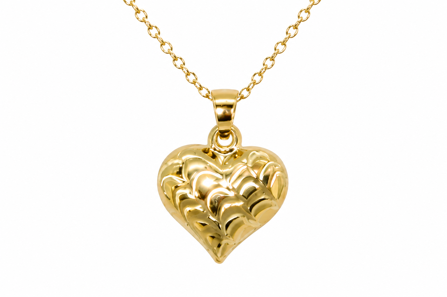 A 9ct gold patterned heart pendant closeup view