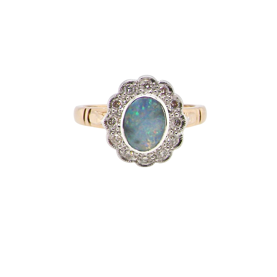 A classic Opal and Diamond cluster ring