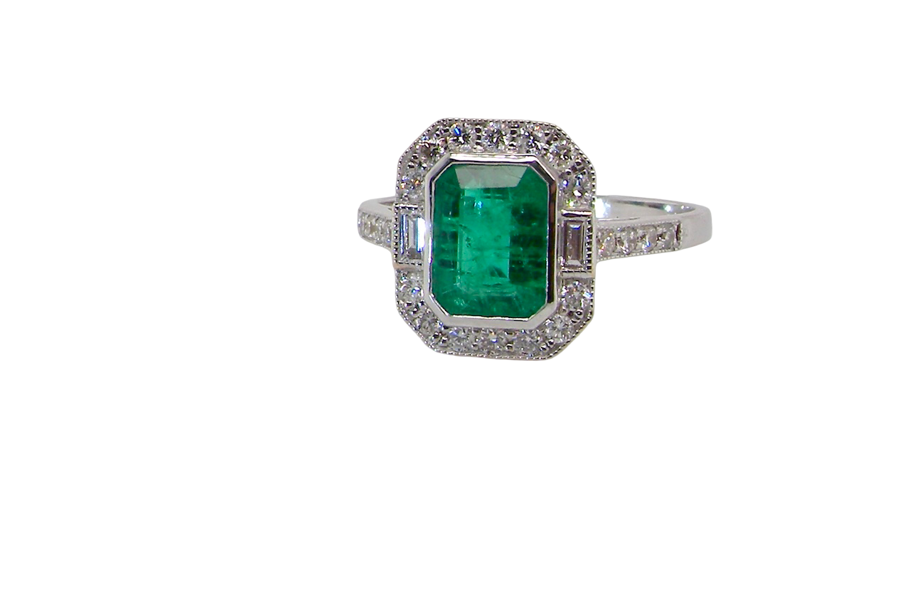 A Emerald and Diamond Engagement ring