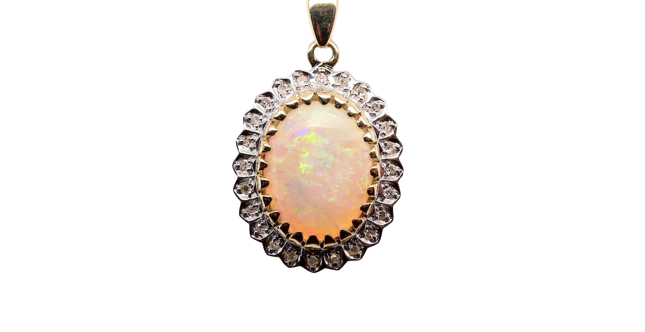 Opal pendant necklace with gold chain on a white background