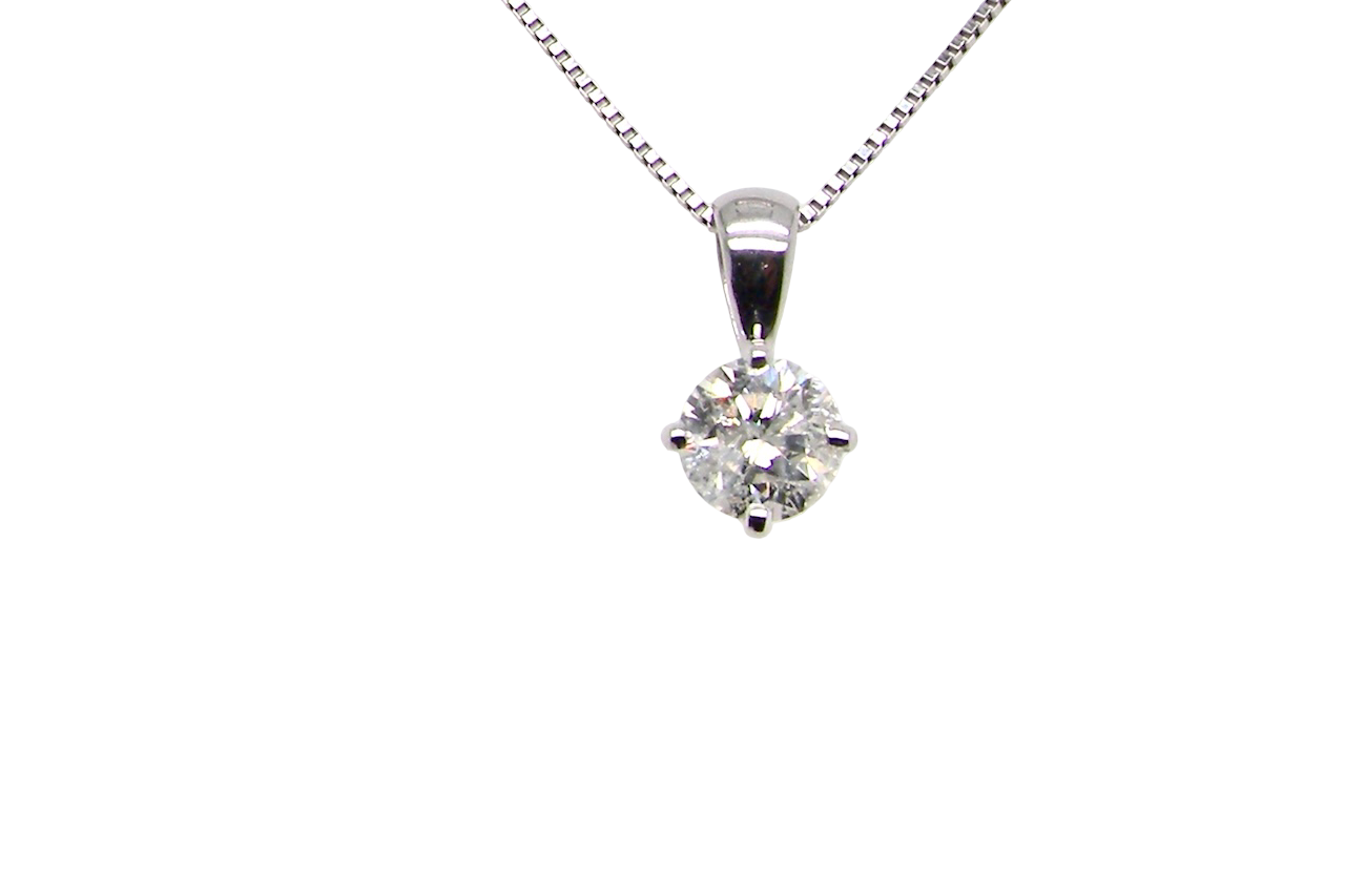 A Classic Platinum Solitaire Diamond Pendant