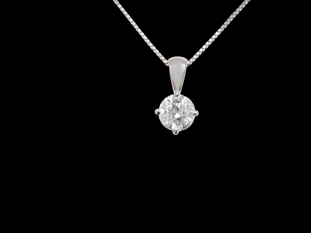A Platinum Solitaire Diamond Pendant