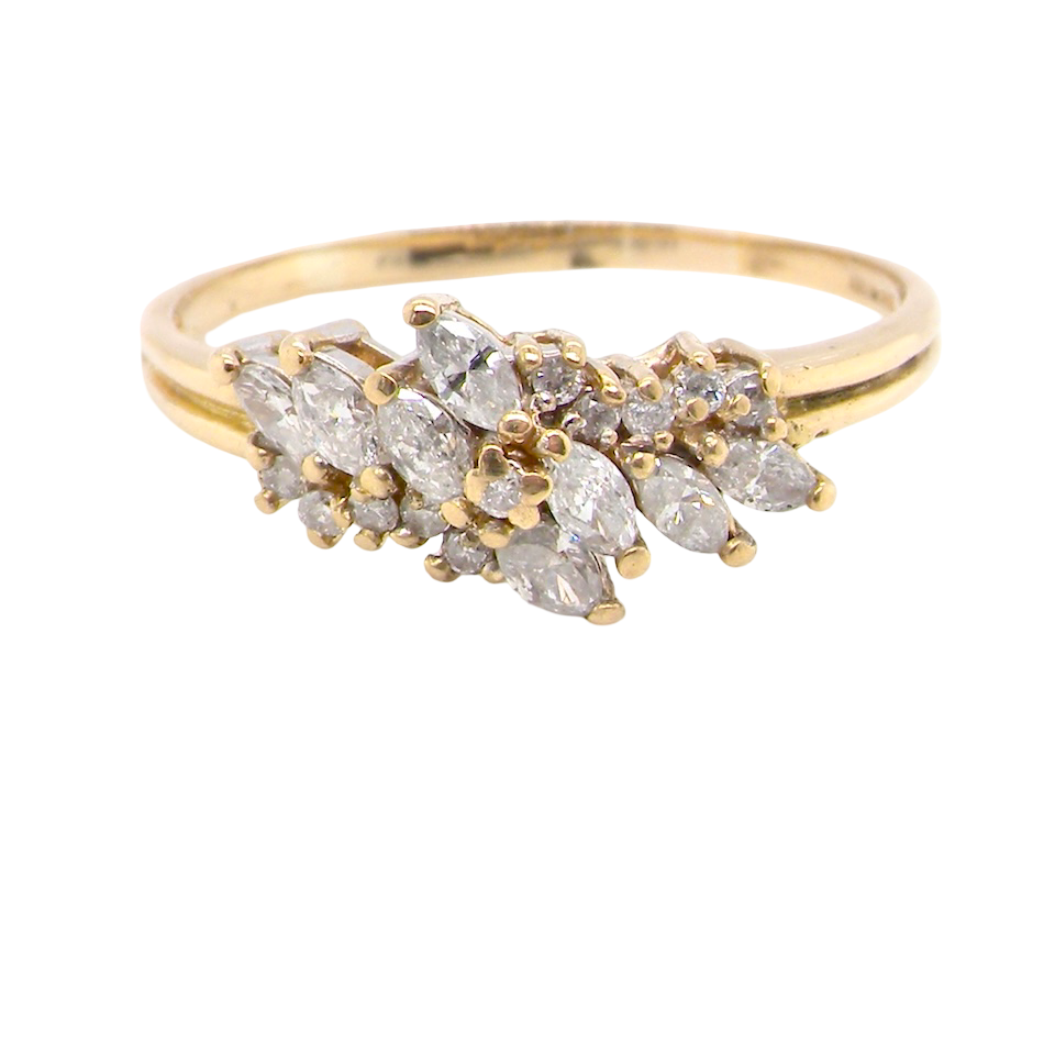Gold ring with diamond stones on a white background