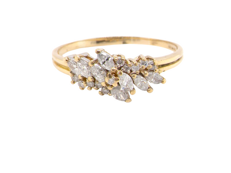 Gold ring with diamond stones on a white background