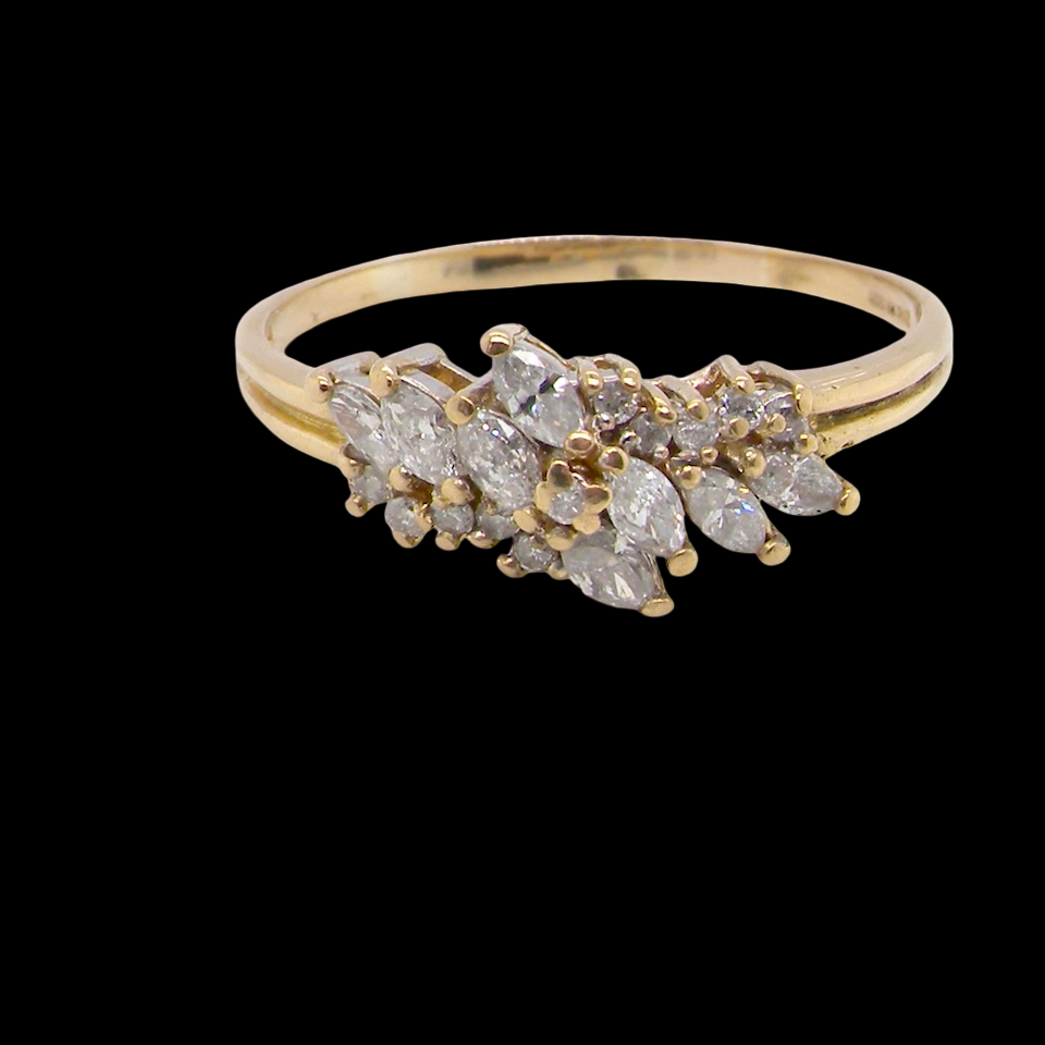 Gold ring with diamond stones on a black background