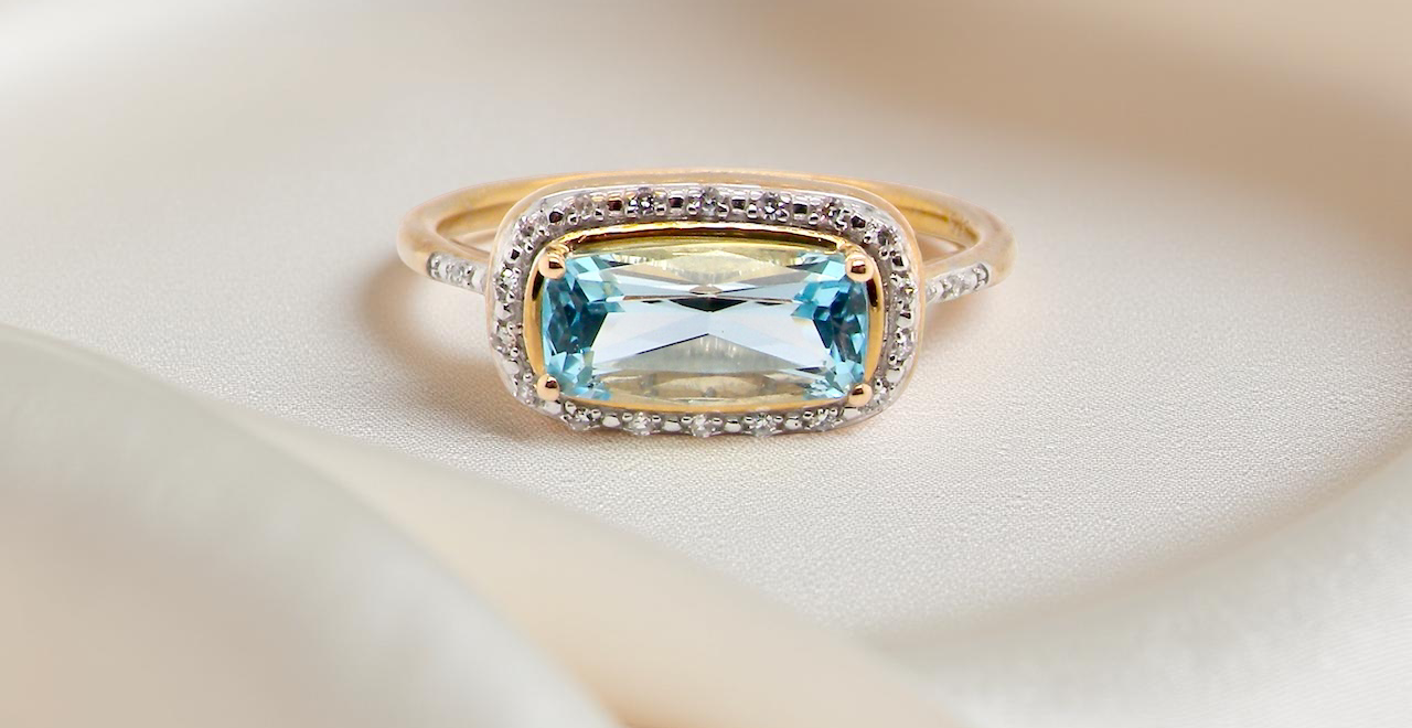 A Modern Blue Topaz & Diamond Cluster Ring