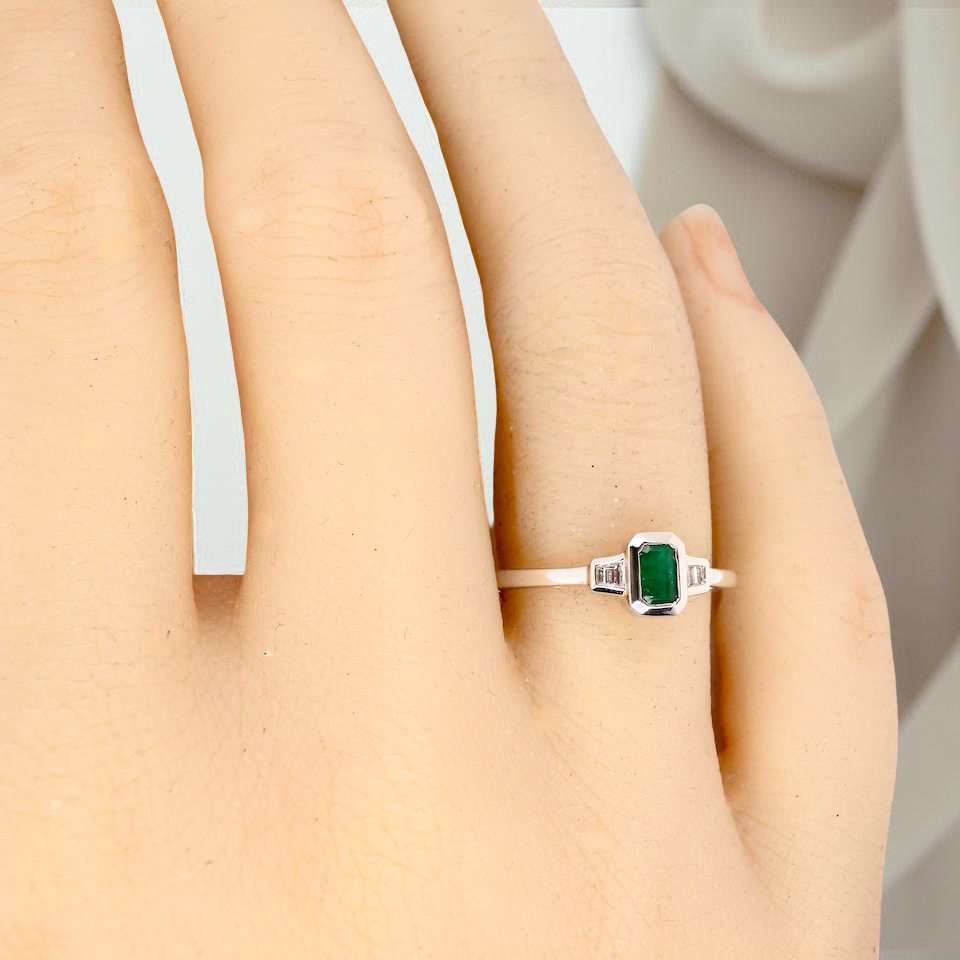 A NEW Emerald and Diamond ring