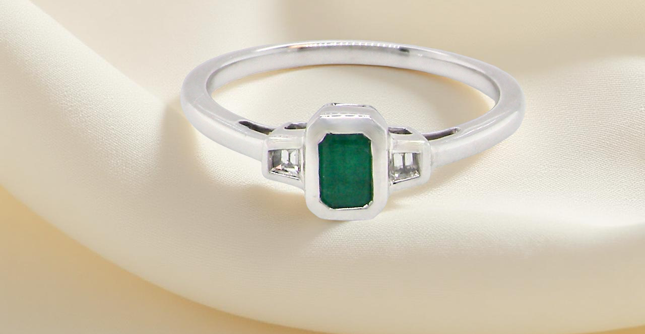 A NEW Emerald and Diamond ring