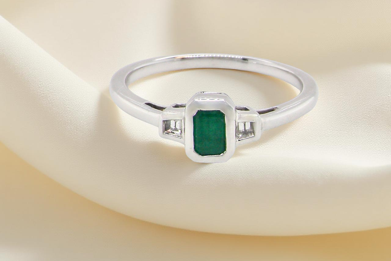 A NEW Emerald and Diamond ring