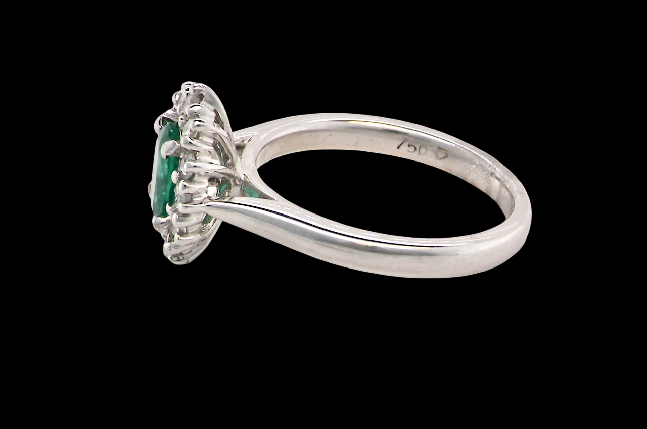 A NEW Emerald and Diamond ring