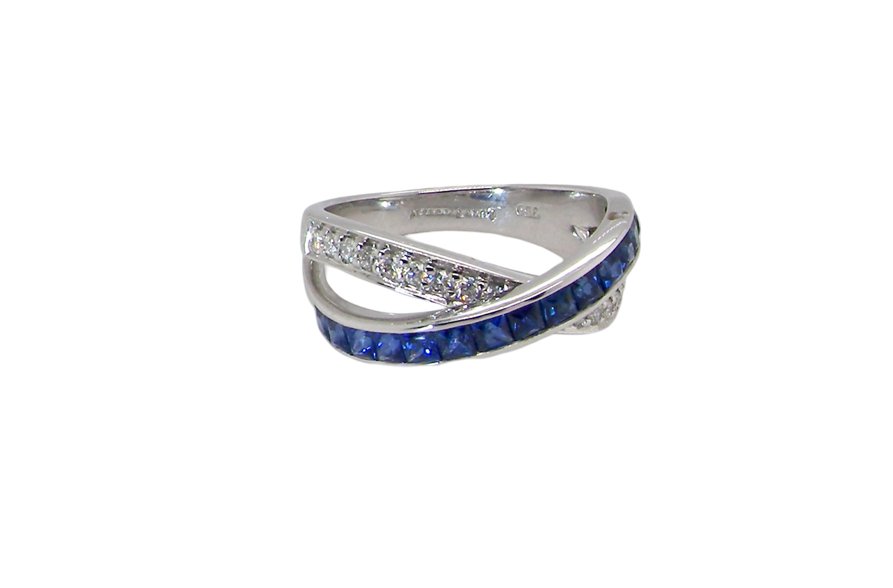 A NEW Sapphire and Diamond cross over ring