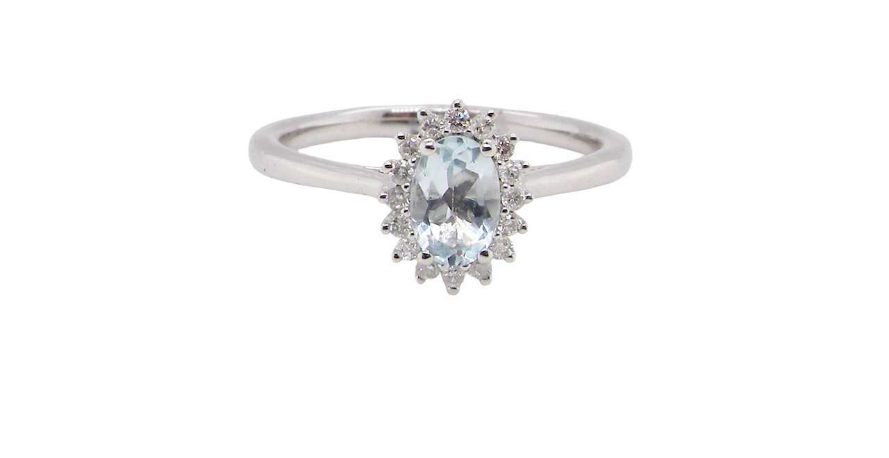 A NEW blue topaz and diamond ring