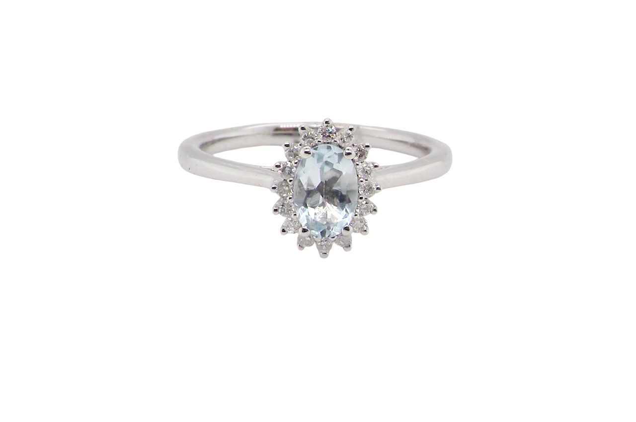 A NEW blue topaz and diamond ring
