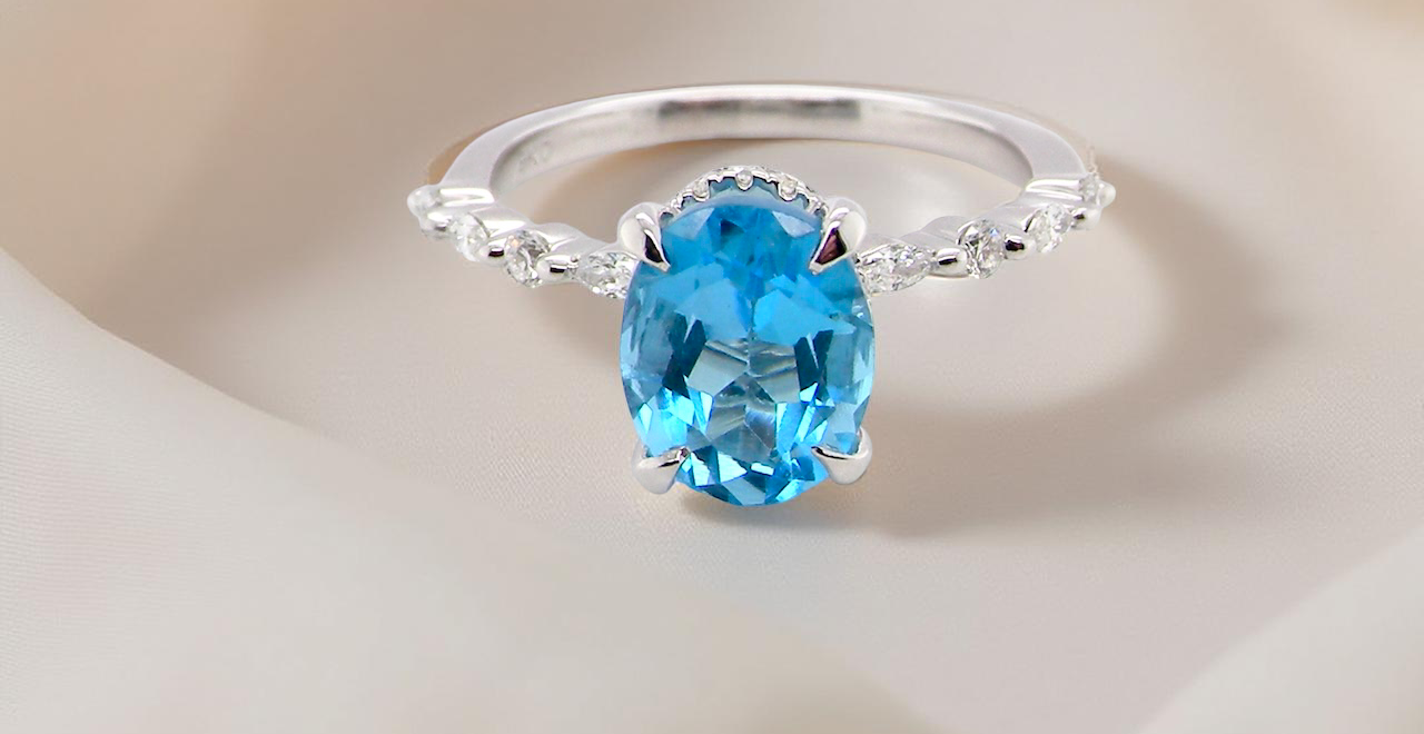 A NEW ring- but with a gemstone that we have taken from an old ring that was worn out, so its a new lease of life! topaz measures 9x7mm.