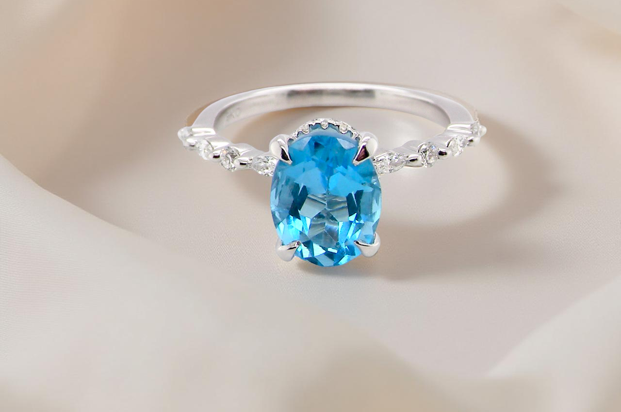 A NEW ring- but with a gemstone that we have taken from an old ring that was worn out, so its a new lease of life! topaz measures 9x7mm.