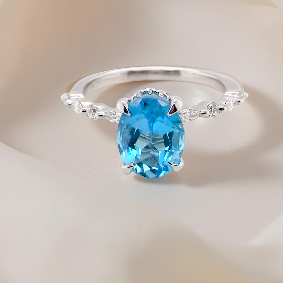 A NEW ring- but with a gemstone that we have taken from an old ring that was worn out, so its a new lease of life! topaz measures 9x7mm.