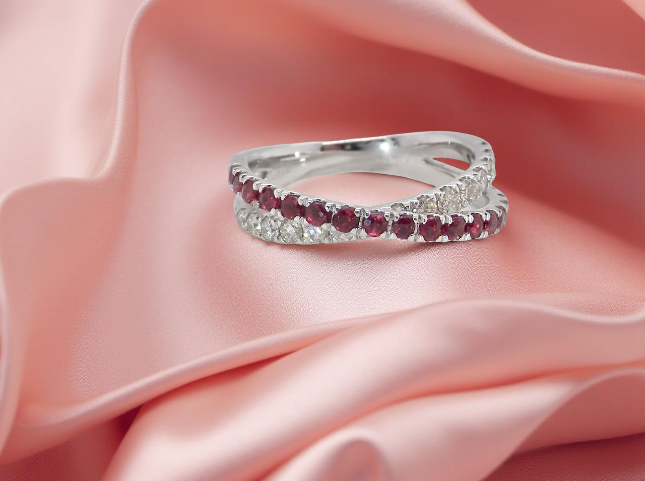 A NEW ruby and diamond cross over ring
