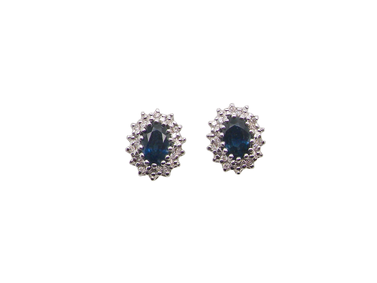 A Pair of Sapphire and Diamond Cluster Earrings