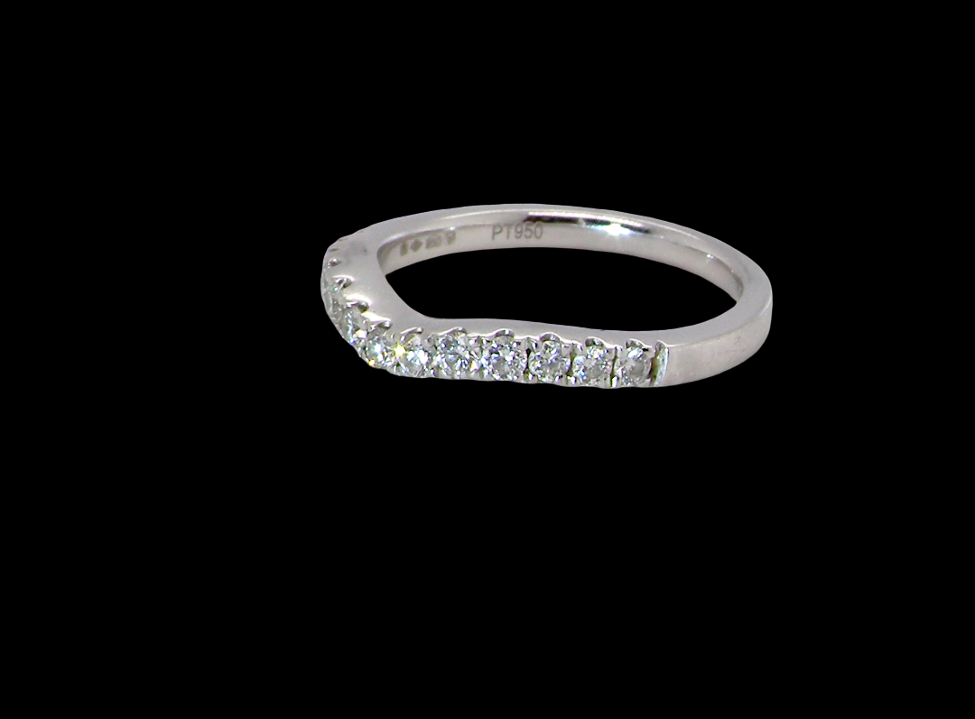 A Platinum half hoop ring featuring a gently contoured U-shaped centre, designed to allow a cluster or solitaire ring to sit comfortably alongside. side