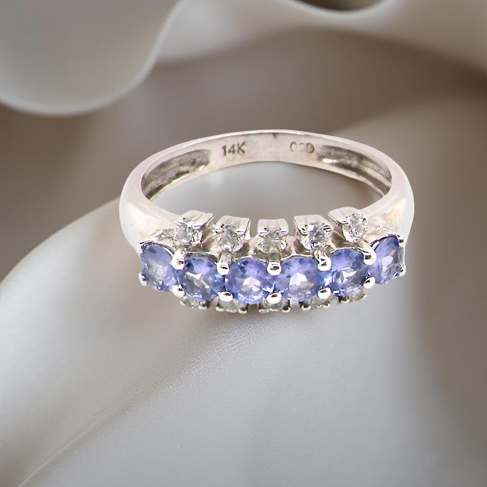 A Tanzanite and Diamond half hoop ring