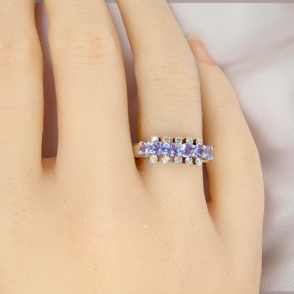 A Tanzanite and Diamond half hoop ring