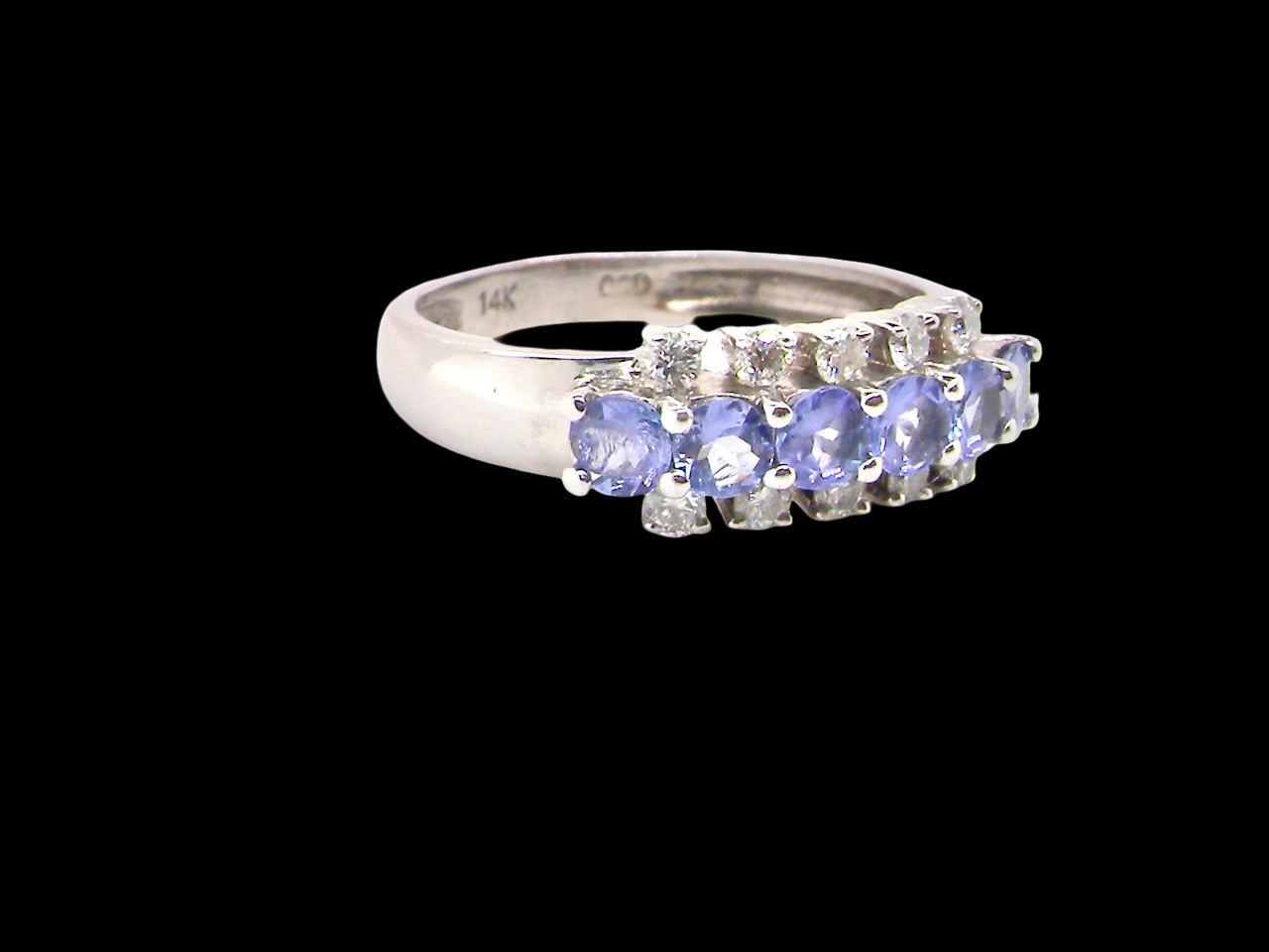 A Tanzanite and Diamond half hoop ring
