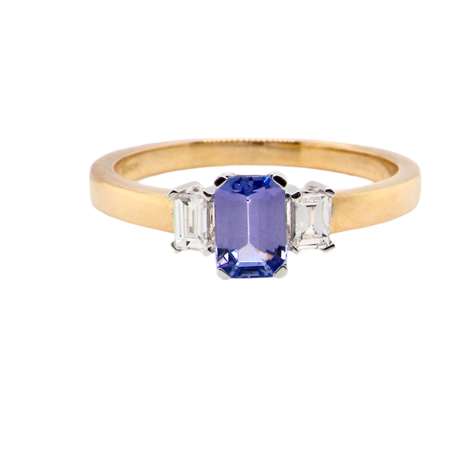 A Tanzanite and Diamond three stone ring