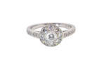 A target cluster diamond ring with a principal diamond surrounded by smaller ones, set in platinum.