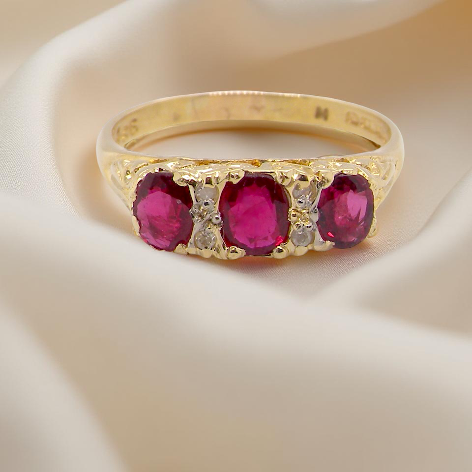 A Victorian Style 18 carat Gold Ruby & Diamond Boat Ring (London 1978)