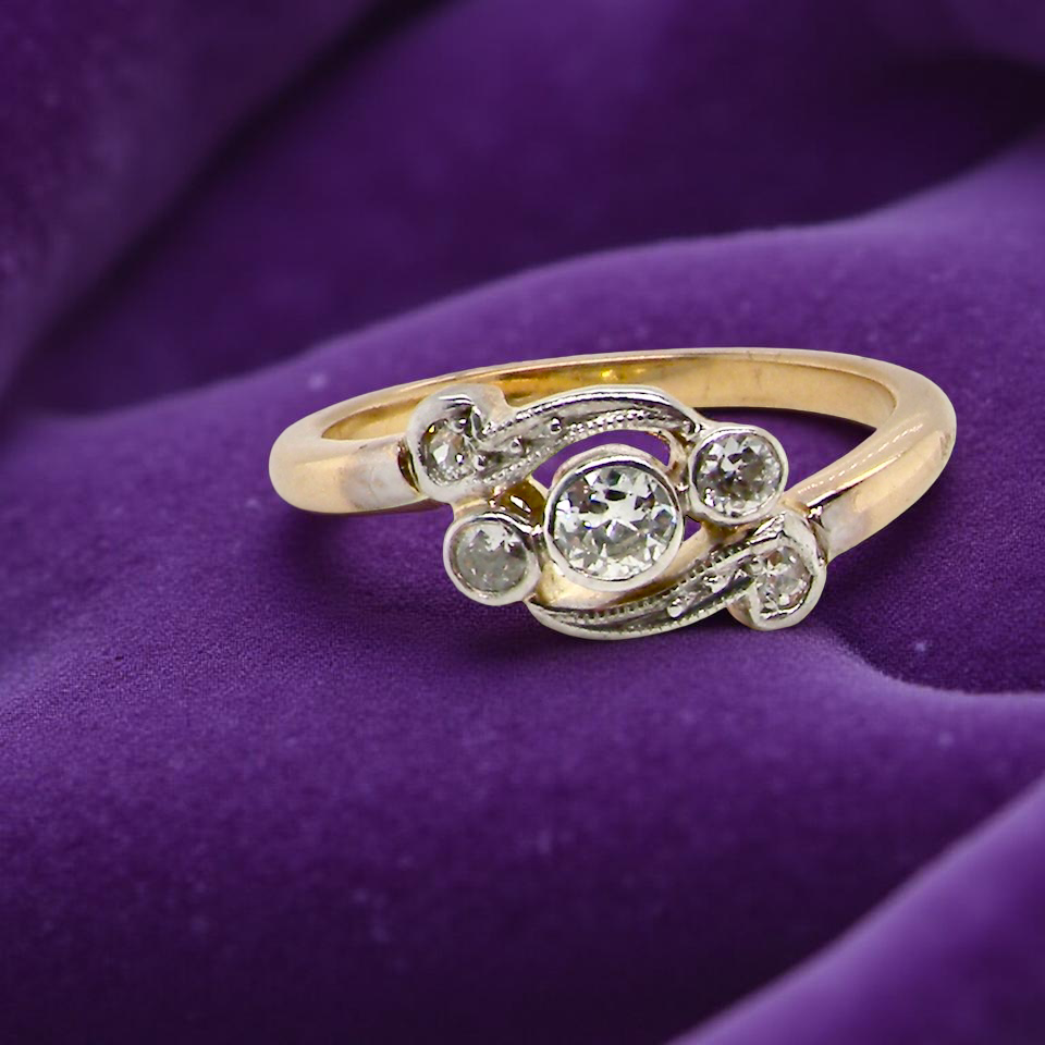 A Vintage Platinum & 18 carat Gold Diamond Crossover Ring (c.1930–1940)