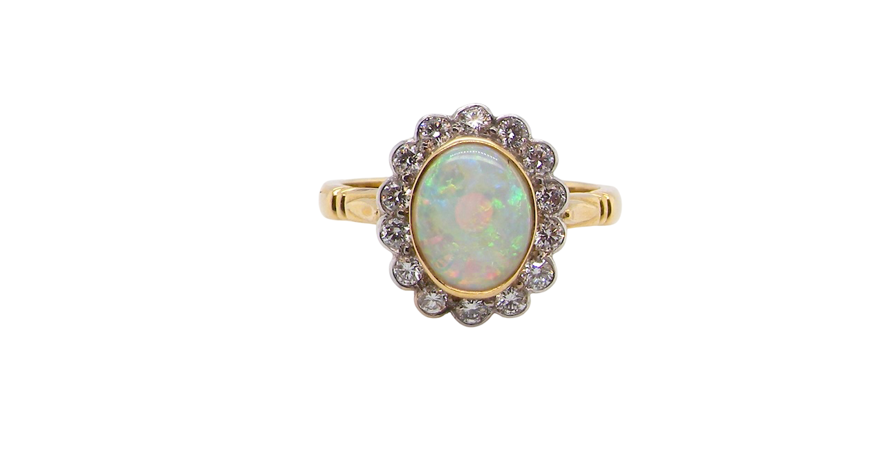 A White Opal and Diamond Cluster Ring