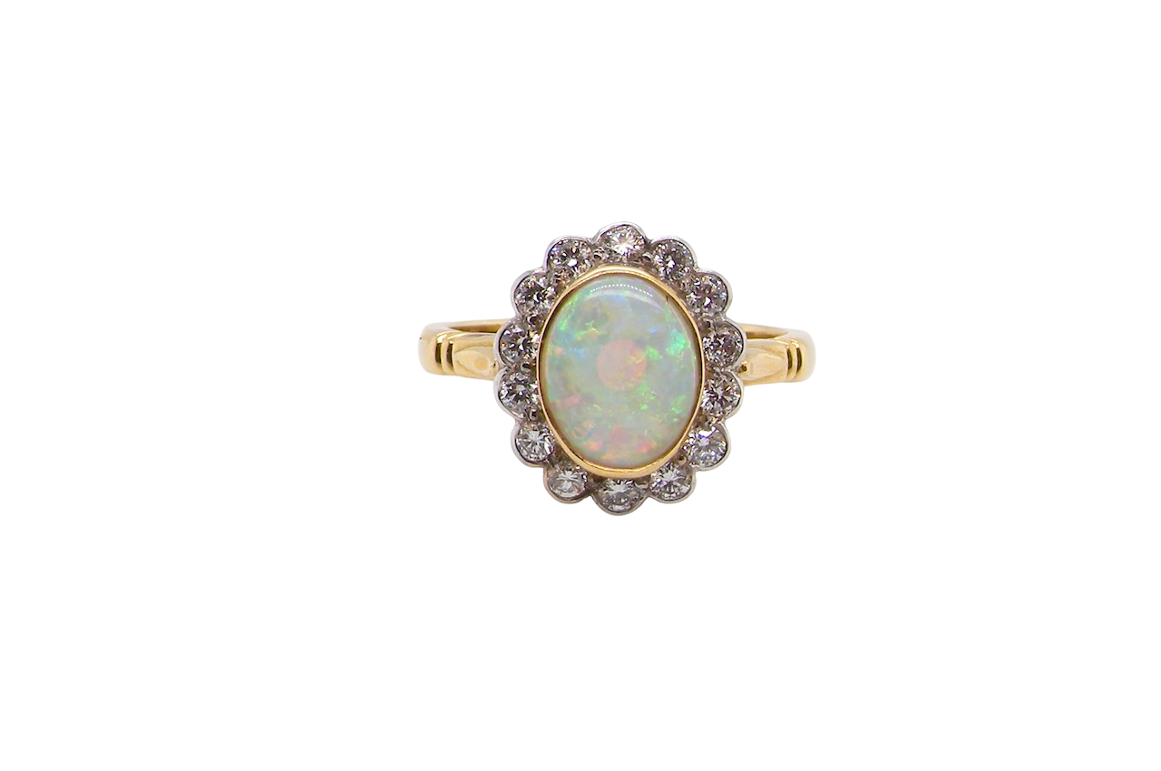 A White Opal and Diamond Cluster Ring