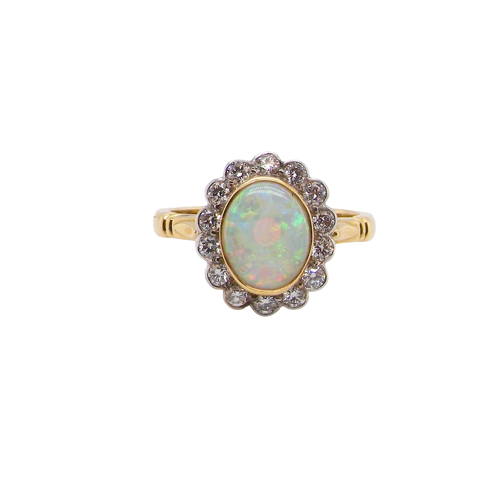 A White Opal and Diamond Cluster Ring